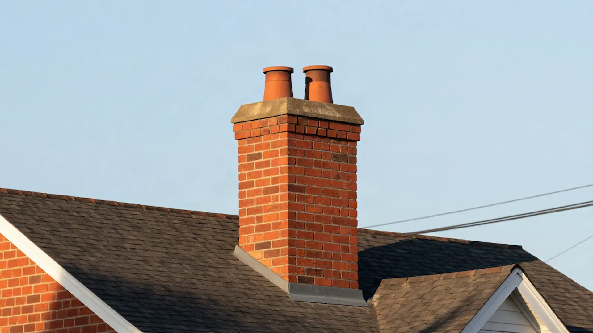 Brick chimney on a home served by K & G Chimney Sweeps in Chicago, IL
